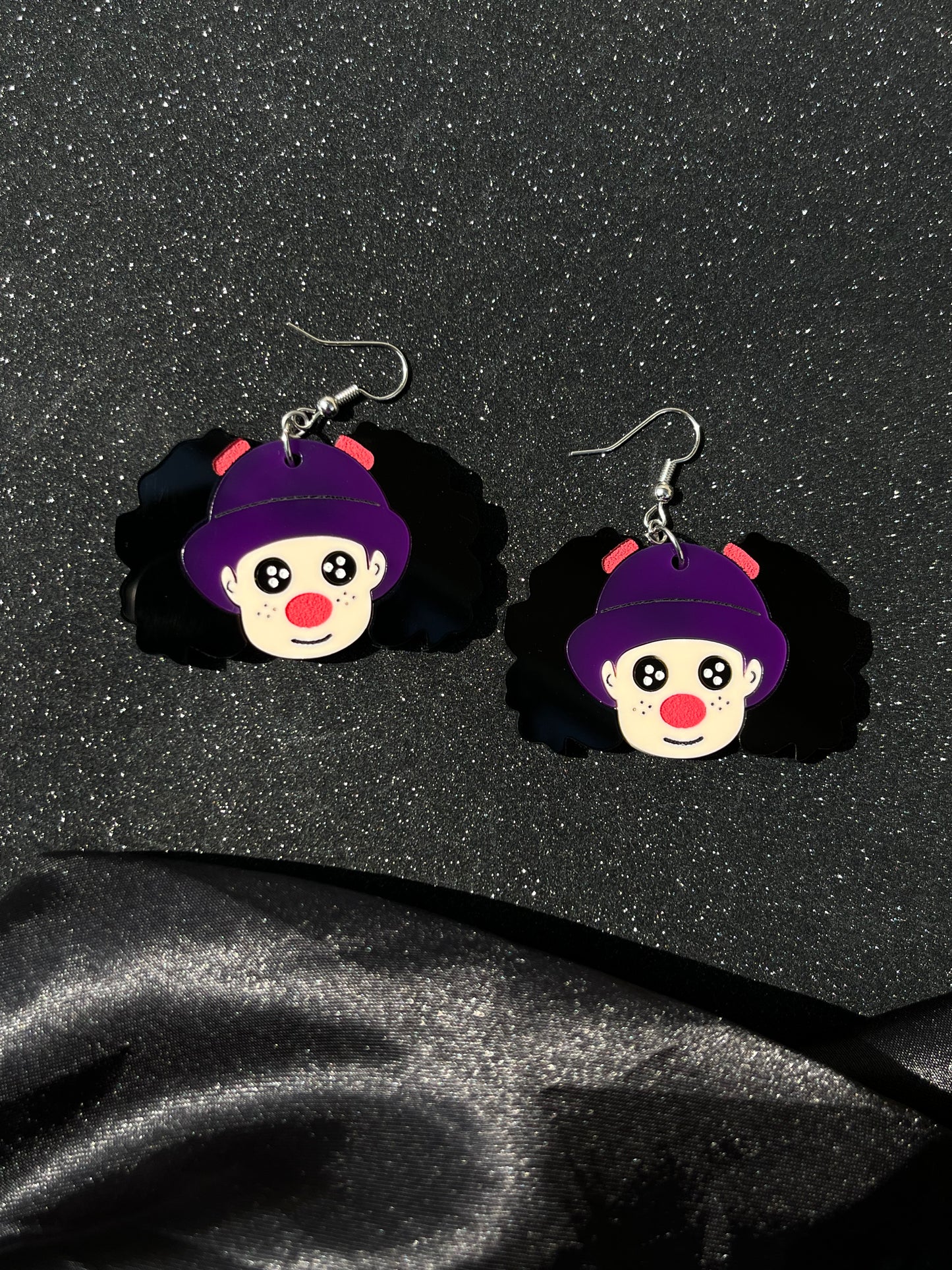 a clown and her dolly