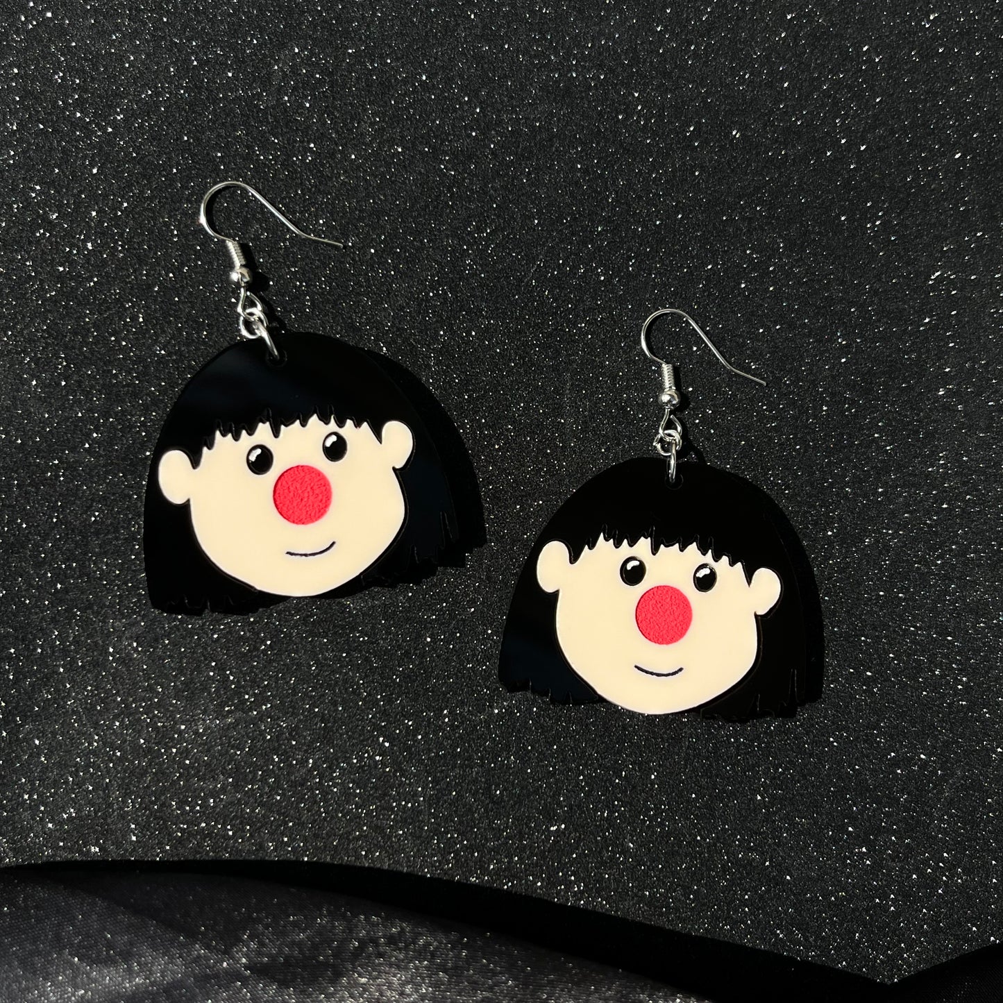 a clown and her dolly